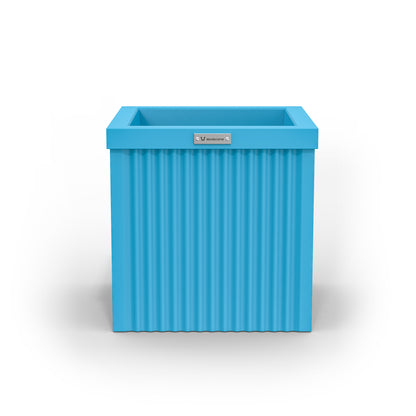 A small cube shaped planter pot in blue made by Modscene. Australian pots.