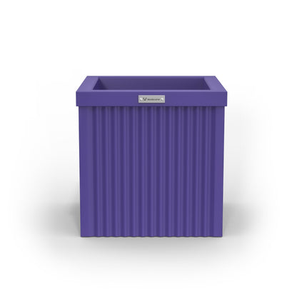 A small cube shaped planter pot in a purple colour made by Modscene.